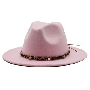 Close-up of pink fedora hat with leopard print band and golden star metal studs
