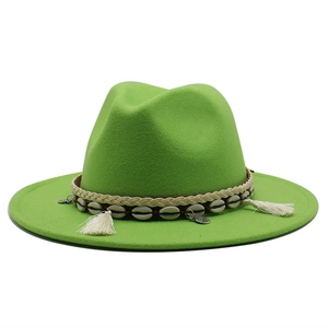 Detail of fruit green wide brim wool fedora with shell and tassel ethnic hat band