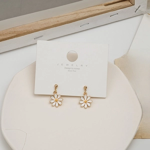 Elegant white daisy earrings with yellow centers on silver posts for women