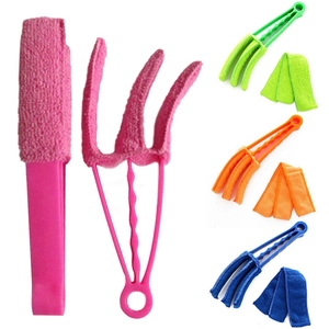 Detail view of microfiber blind cleaner tool showing removable sleeves in multiple colors