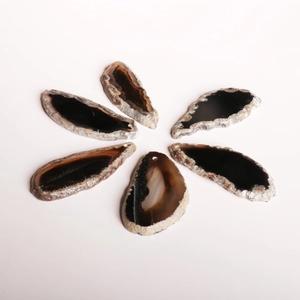 Detailed view of seven natural agate slices with unique patterns and top-drilled holes