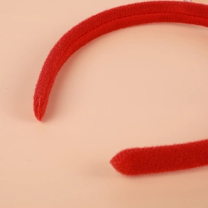 Red velvet Christmas headband with reindeer elk horns and soft plush fabric texture