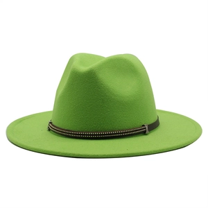 Detail of neon green wool fedora crown with decorative brown studded leather belt