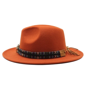 Detail of wool fedora hat with ethnic woven band and side leather fringe accents