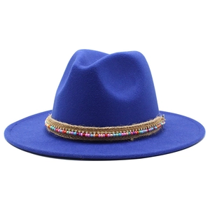 Close-up of royal blue wool fedora with bohemian beaded band and rhinestone details