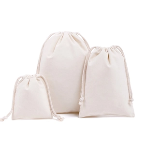 Three-piece set of cream white cotton drawstring bags in small medium large sizes