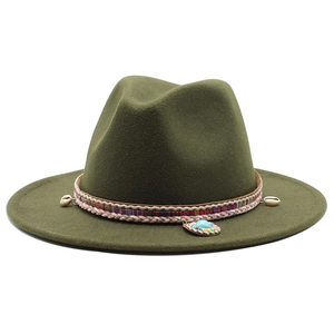 Detail of dark green fedora hat with woven band, shells, and turquoise pendant