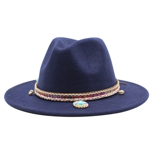 Detail of navy wool fedora featuring ethnic woven band with shells and beads