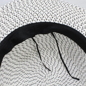 Adjustable black and white straw sun hat with internal sweatband and adjustment strings