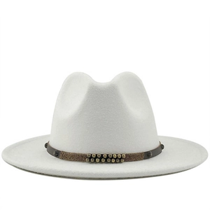 Detail of white fedora hat featuring a brown leather band with metallic rivet accents