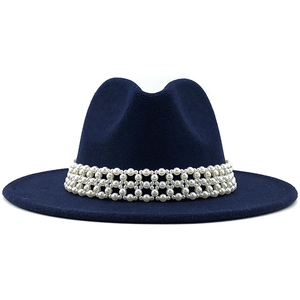 Detail shot of navy wool fedora with ornate white pearl band decoration