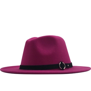 Detail of dark fuchsia wool fedora hat featuring black ribbon with silver metal ring