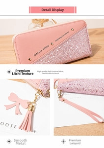 Detail of pink long wallet showing lychee grain texture, sequins and tassel zipper
