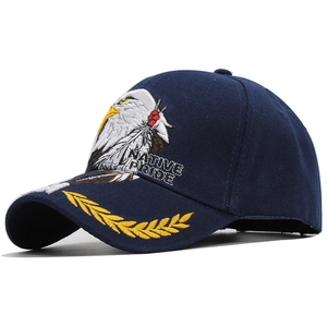 Detail of Native Pride eagle embroidery and golden laurel leaf on navy baseball cap