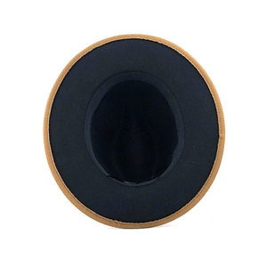 Detailed interior view of a dual-tone fedora hat with black and brown wool felt material