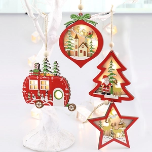 Close-up of wooden Christmas lanterns with LED lights featuring Santa and reindeer motifs