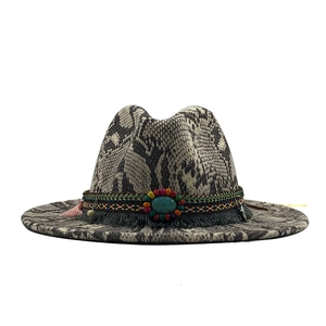 Chic snake print fedora hat featuring a bohemian woven band and turquoise stone detail
