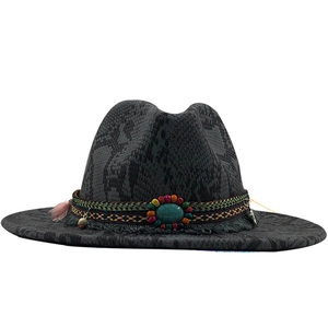 Detail of dark grey fedora with snakeskin texture and ethnic turquoise beaded band