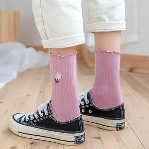 Pink cotton crew socks with ruffle trim and daisy embroidery for women's casual wear