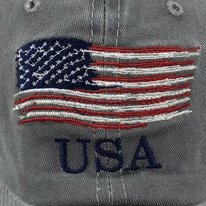 Detailed close-up of embroidered American flag and USA text on vintage grey cotton cap