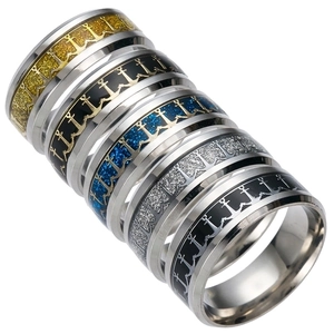 Detail view of five stainless steel rings with colorful nautical anchor patterns