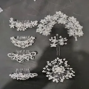 Detailed 7-piece bridal hair accessory set featuring pearls and rhinestones on silver base