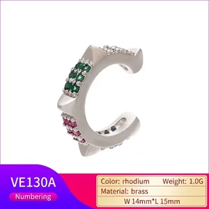 Rhodium plated brass ear cuff with green and magenta cubic zirconia in starburst design