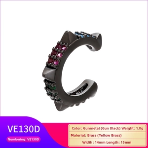 Detailed view of gunmetal brass ear cuff with colorful zircons and spiked design details