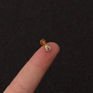 Gold stainless steel flat-back piercing stud with round zircon and milgrain detail