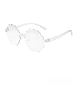 Macro view of transparent rimless octagonal sunglasses with waved edge cutting detail