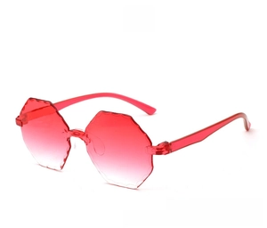 Detail of red rimless sunglasses with octagonal wavy-cut lenses and transparent temples