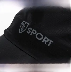 Detail of black quick-dry fabric with SPORT print and micro-grid texture on sports cap