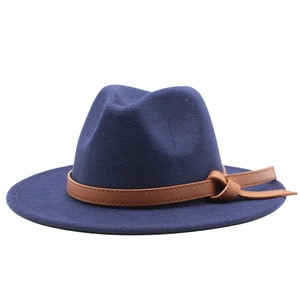 Detail of navy wool felt fedora featuring a vintage brown leather belt with a simple knot