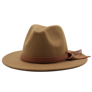 Detail of caramel wool felt fedora featuring a decorative brown leather hatband with knot