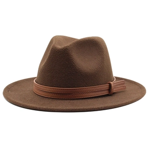 Detail of a brown wool fedora hat featuring a double leather buckle strap and wide brim