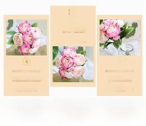 Detail of faux pink peony bouquet with green leaves in a vintage home decor setting