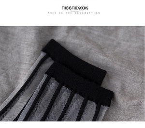 Detail of breathable mesh vertical stripe crew socks with black ribbed cuffs