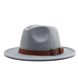 Close-up of light gray wool fedora hat with brown leather band and metal buckle