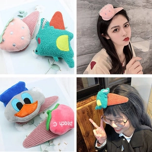 Close-up of plush cartoon bear hair clips and accessories with high elasticity bands
