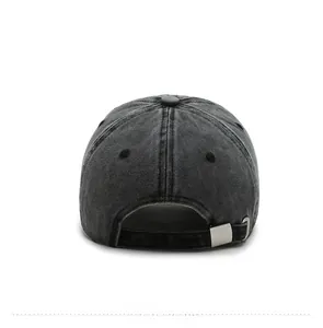 Detail view of denim baseball cap back with adjustable silver metal buckle and strap