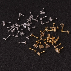 Various gold and silver stainless steel stud earrings with small zircon stone accents