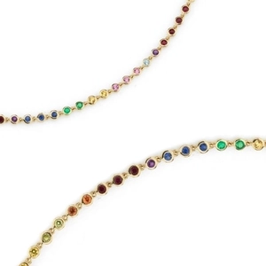 Elegant gold necklace with rainbow colored cubic zirconia stones on white background