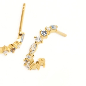 Elegant gold-tone C-shape hoop earrings set with colorful sparkling cubic zirconia stones