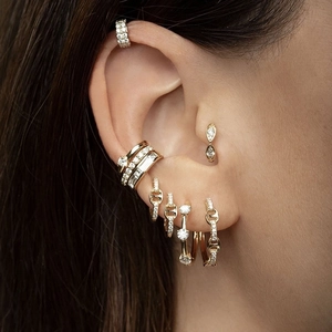 Chic S925 silver needle hoop earrings with rainbow cubic zirconia on a model ear