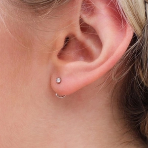 Minimalist S925 silver stud earring with zircon and small hoop earring on model ear