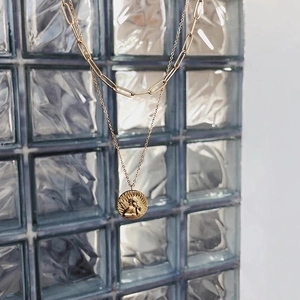 Double-layer gold paperclip chain necklace with a vintage cupid angel coin pendant