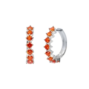 Detail of silver hoop earrings with seven prong-set round orange cubic zirconia stones