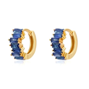 Close-up of C-shaped gold hoop earrings featuring rectangular deep blue zircon stones