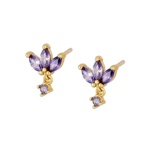 Detailed macro view of gold butterfly earrings set with sparkling purple zircon stones