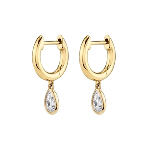 Close-up of gold geometric earrings with pear-cut white crystals and high-polish finish